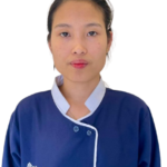 Portrait of a young Asian woman wearing a blue uniform with a light-blue collar, facing the camera.