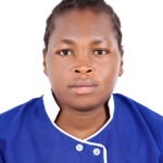 Portrait of a woman facing the camera, wearing a blue uniform with white trim against a white background.