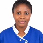 Portrait of a woman in blue medical scrubs with white trim, smiling at the camera on a white background (professional headshot).