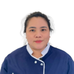 Portrait of a woman in a blue uniform with white trim and the 'Excellence Center' logo, facing the camera.