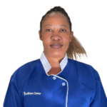 Portrait of a woman facing the camera, wearing a blue uniform with white collar and trim.